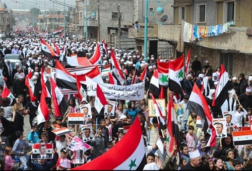 People rally in suburban Damascus to show strong support for Syrian army