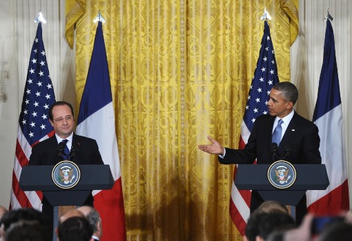 Obama greets Frances leader, but warns against doing business with Iran