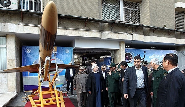 Iran displays combat drone armed with home-made missiles
