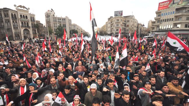 People rally across Syria, voice support for army