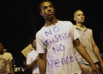 Ferguson protests cool after top US attorney general visits