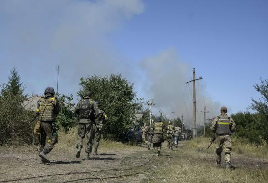 Ukraine leader says Russian forces are in the country as key town falls
