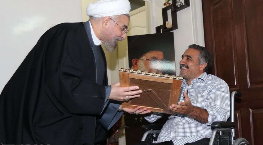 President Rouhani meets with disabled war veteran