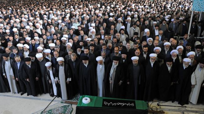 Iranians remember late cleric; Leader leads memorial prayers