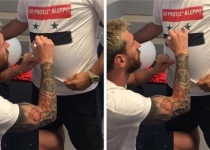 Lionel Messi signs T-shirt of pro-Assad fan