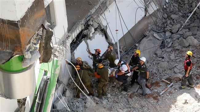 2 dead, several missing as building collapses in Tel Aviv