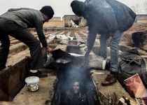 Images of homeless living in graves shock Iran