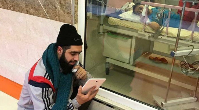Iranian teacher visits bed-ridden boy fighting cancer in hospital