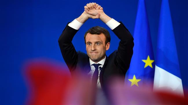 Macron pledges to turn new page in French politics