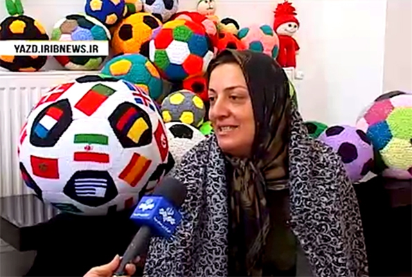 Iranian woman makes football with flags of all World Cup teams
