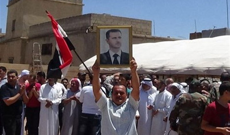 Syrians celebrate defeat of militants in southern areas