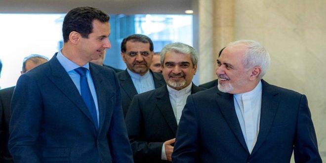 President al-Assad to Zarif: Adherence to national principles and peoples interests protects any country