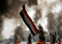 Protesters burn Al-Hakim