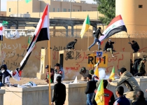 Iraqi militiamen hurl stones at US Embassy, prepare for extended stay