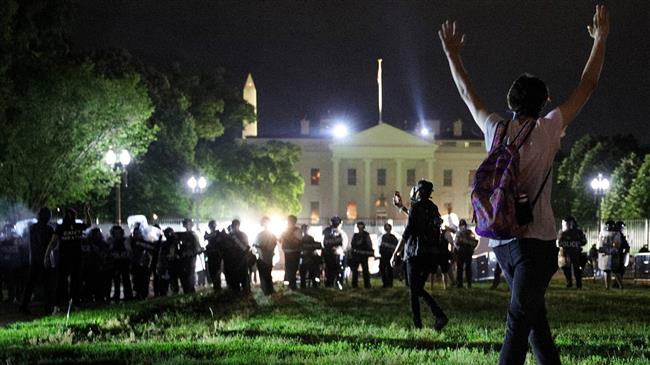Protesters circle White House grounds as curfews go into effect nationwide