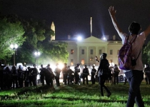 Protesters circle White House grounds as curfews go into effect nationwide