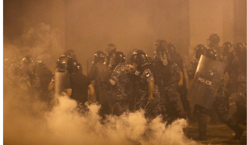 Beirut police fire tear gas as protesters regroup and two ministers quit