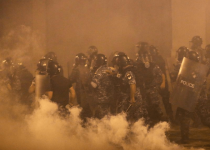 Beirut police fire tear gas as protesters regroup and two ministers quit