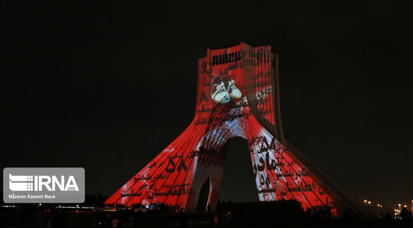 Tehran Azadi Tower lit up with colors of Afghan flag in honor of Kabul school victims