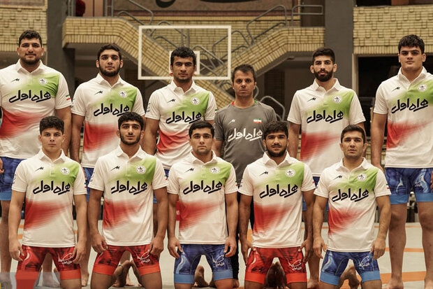 Raisi congratulates winning world title by Iranian wrestlers