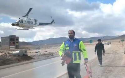 An Afghan worker transported by emergency helicopter to Qom