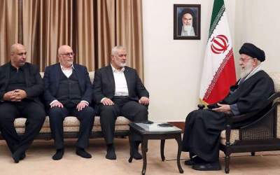 Leader of the Islamic Revolution Ayatollah Seyyed Ali Khamenei (R) met with a delegation representing the Palestinian resistance movement Hamas which was led by the group’s politburo chief Ismail Haniyeh (center) in Tehran on March 26, 2024.