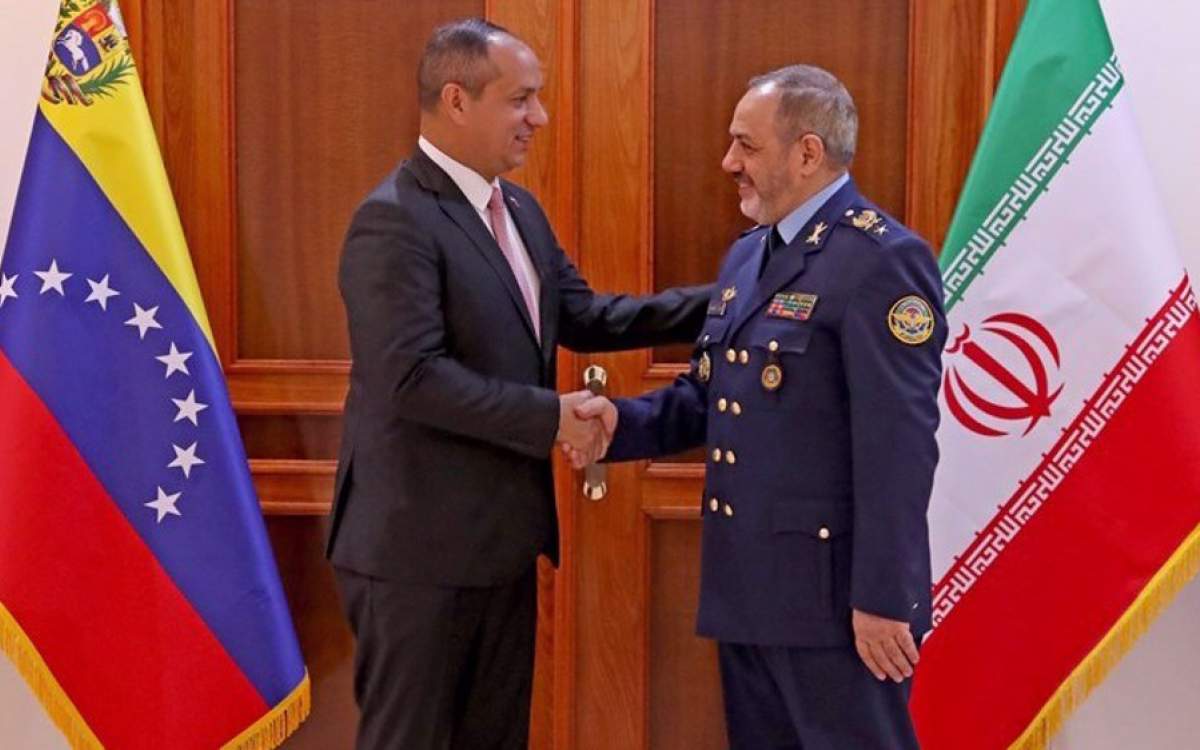 Iran’s Defense Minister Brigadier General Aziz Nasirzadeh (R) shakes hands with Venezuela’s Minister of Transportation Ramon Blazquez in Tehran, Iran, on September 19, 2024.