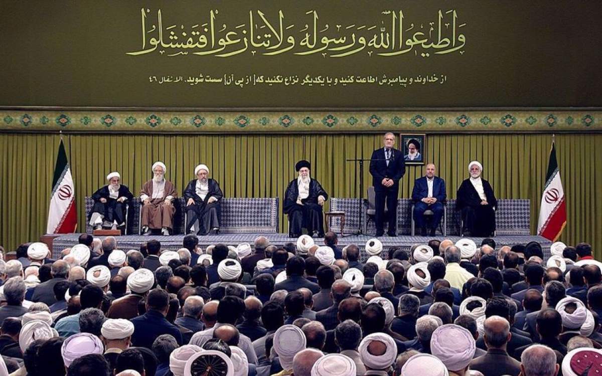 Ayatollah Khamenei listens as President Masoud Pezeshkian makes a speech during the Leader of the Islamic Revolution