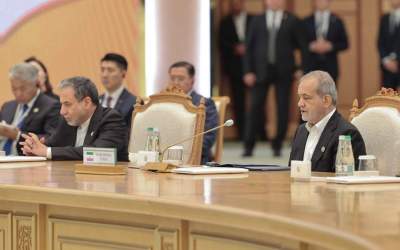 Iranian President Masoud Pezeshkian (R) speaks at a ceremony on the 300th birthday anniversary of Turkmen poet Magtymguly Pyragy in the capital Ashgabat on October 11, 2024.