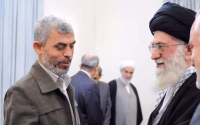 Ayatollah Khamenei receives Hamas leader Yahya Sinwar (L) in Tehran on Feb. 12, 2012.