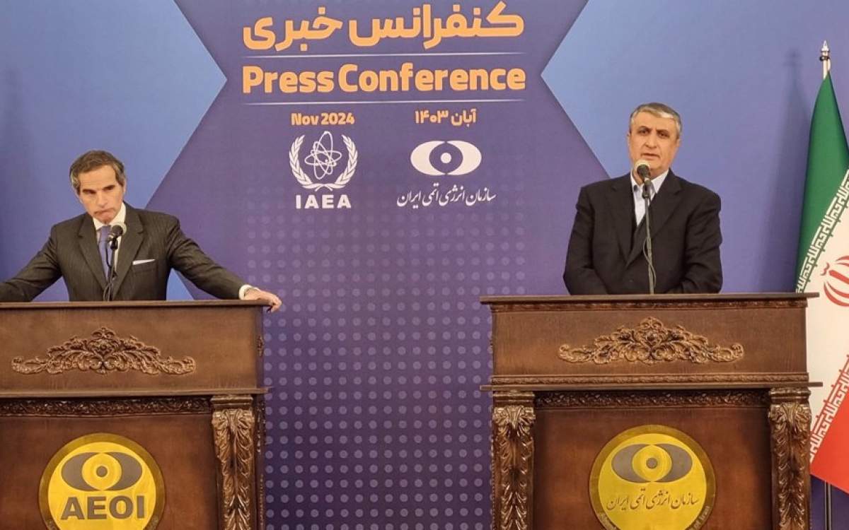 Mohammad Eslami (R), head of the Atomic Energy Organization of Iran (AEOI), speaks during a press conference with Director General of the International Atomic Energy Agency (IAEA) Rafael Grossi, in Tehran on November 14, 2024.