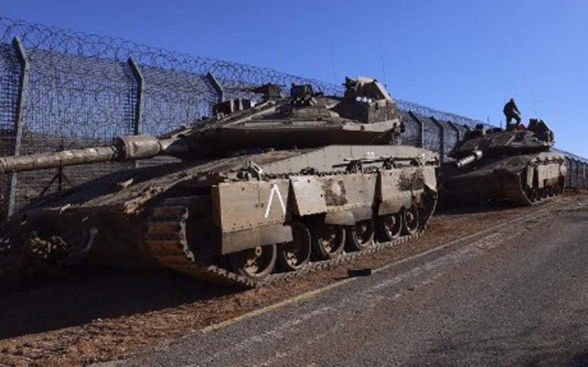 Israeli troops deploy at the buffer zone that separates the Israeli-occupied Golan Heights from the rest of Syria, on December 9, 2024.