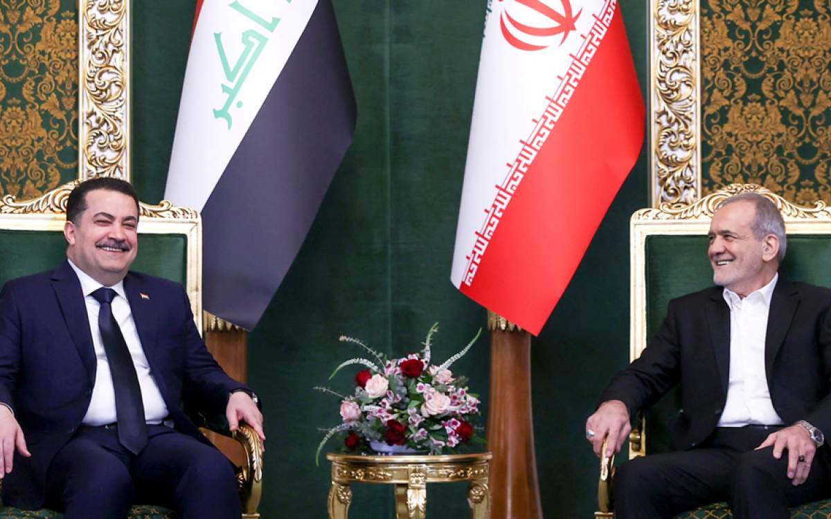 Iran’s President Masoud Pezeshkian (R) holds talks with Iraq’s Prime Minister Mohammed Shia’ al-Sudani, in the capital Tehran, on January 8, 2025.