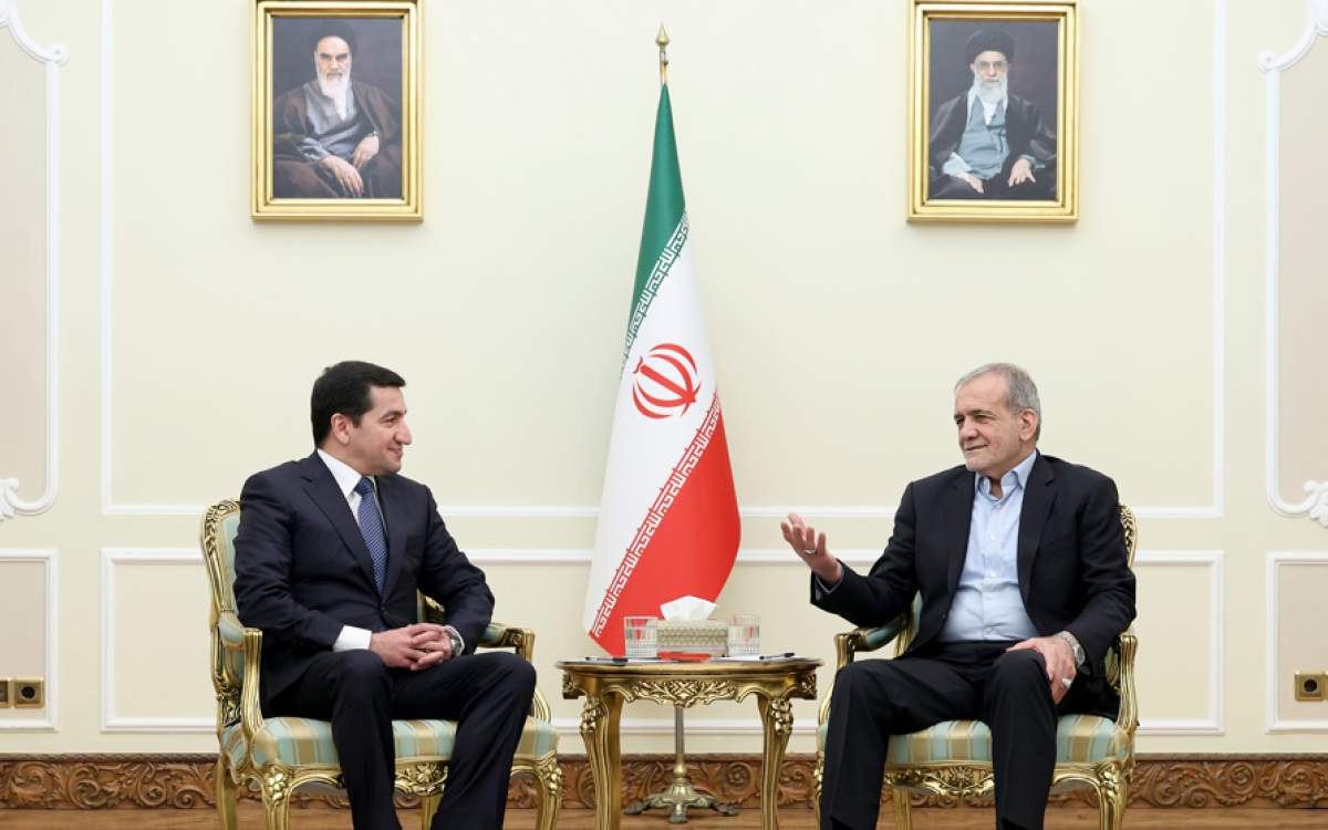 Iranian President Masoud Pezeshkian (R) and Assistant to the President of Azerbaijan Hikmet Hajiyev meet in Tehran on February 3, 2025.