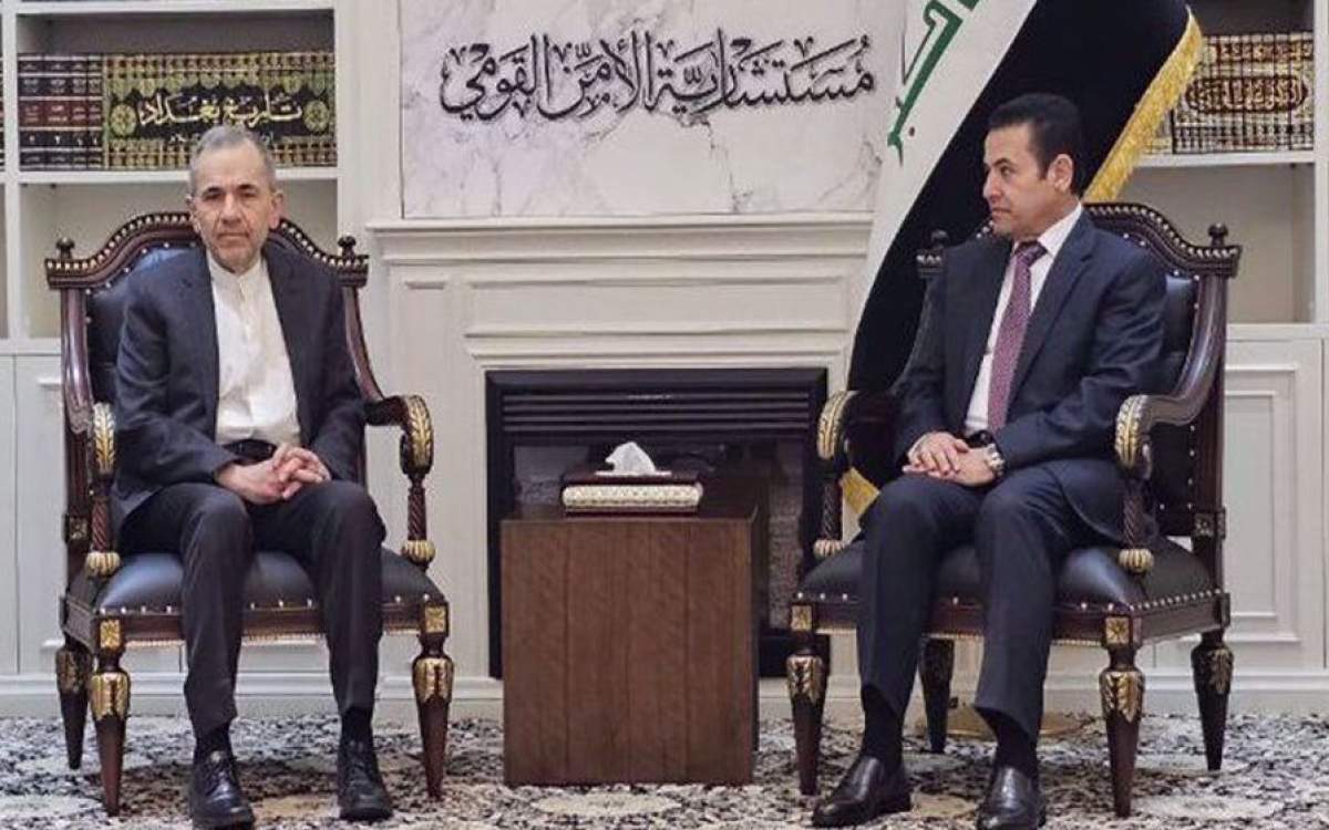 Iranian Deputy Foreign Minister for Political Affairs Majid Takht Ravanchi (L) and Iraqi National Security Advisor Qasim al-Araji meet in Baghdad on February 17, 2025.