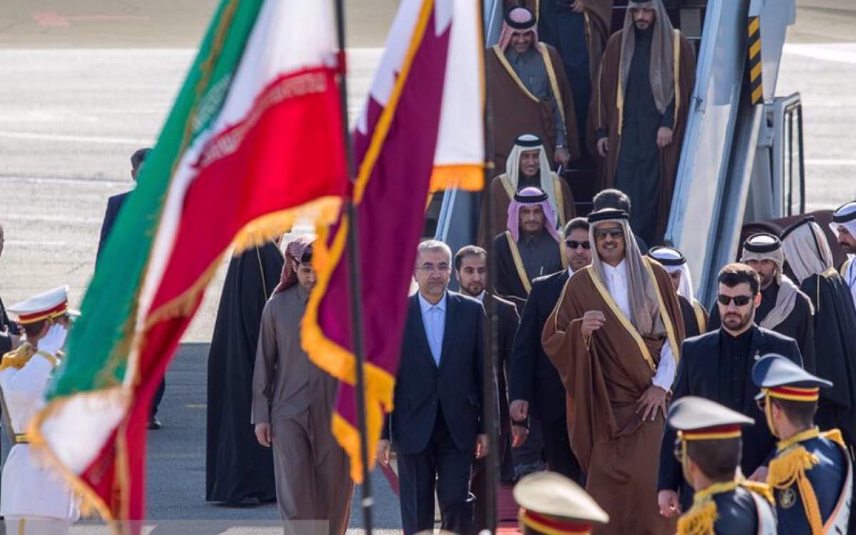 Qatar’s Emir Sheikh Tamim bin Hamad Al Thani (C) arrives at Mehrabad Airport in Tehran on Wednesday.