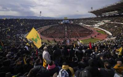 A giant banner portraying Hezbollah’s late leader Sayyed Hassan Nasrallah (L) and Hashem Safieddine, his successor, hangs in Beirut’s Camille Chamoun Sports City Stadium on February 22, 2025.